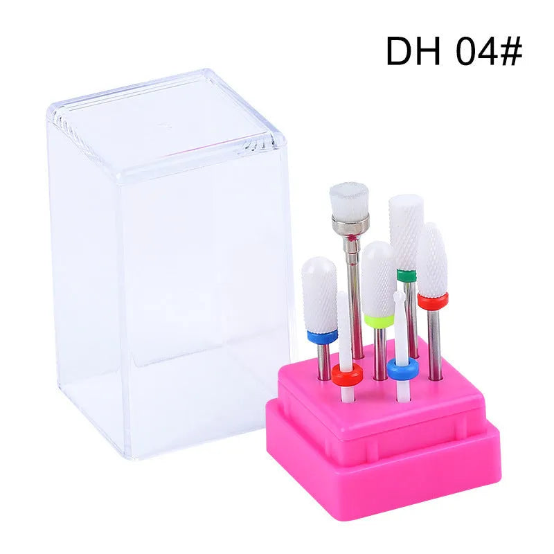 Tungsten steel nail art drill bit set with six bits, one brush, in a clear case.