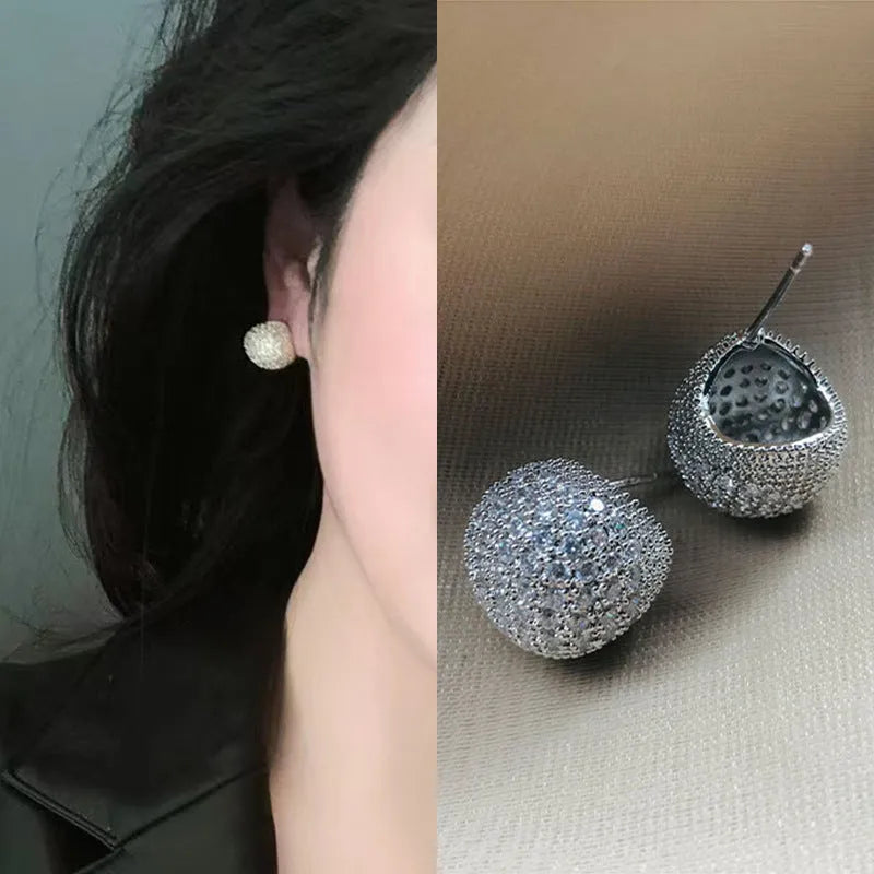 Little Golden Beans geometric drop earrings with spherical elements and diamond detailing in gold and white colours