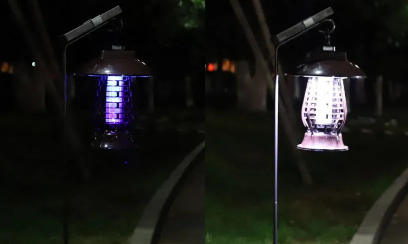 White outdoor solar mosquito lamp with purple switch and solar panel on top for garden insect control.