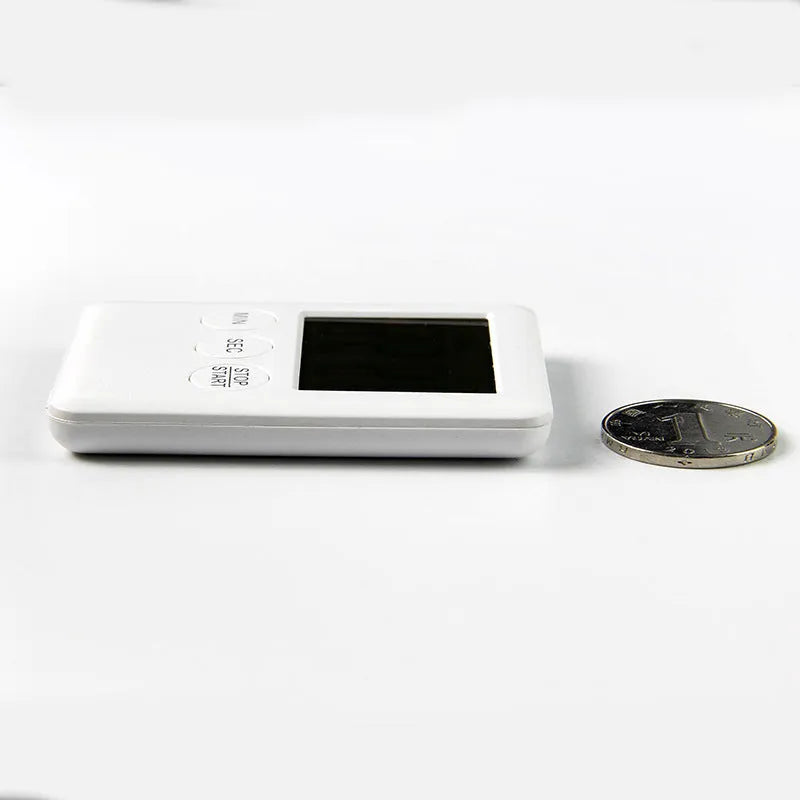 Magnetic kitchen timer with LCD screen showing time display, available in black and white colours