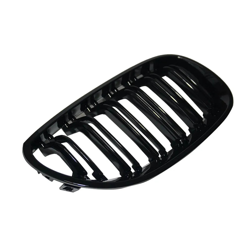 Carbon fibre pattern front grille for BMW 5-Series E60 E66 models on black background.