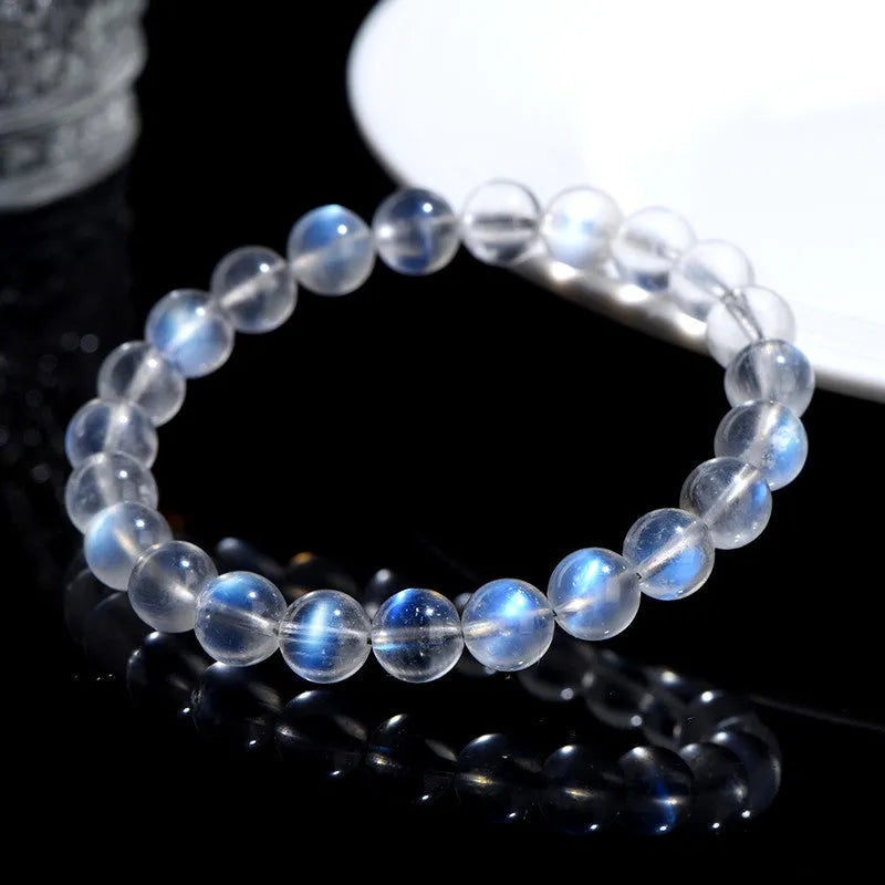 Natural cream blue moonlight crystal bracelet with polished surfaces and simple unisex design