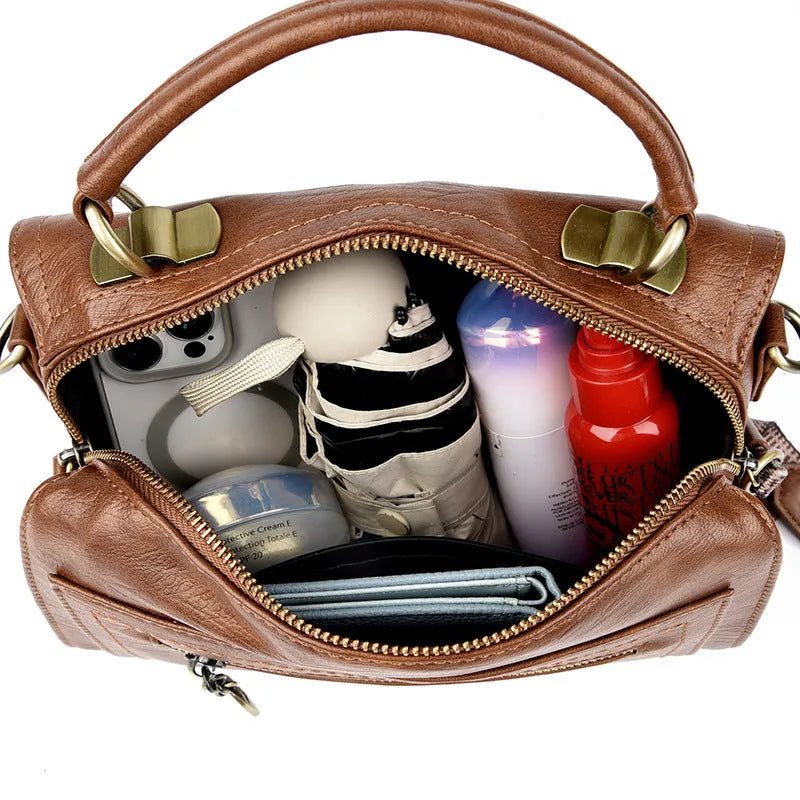 Women's grey PU leather one-shoulder crossbody bag with a square shape and outer pocket