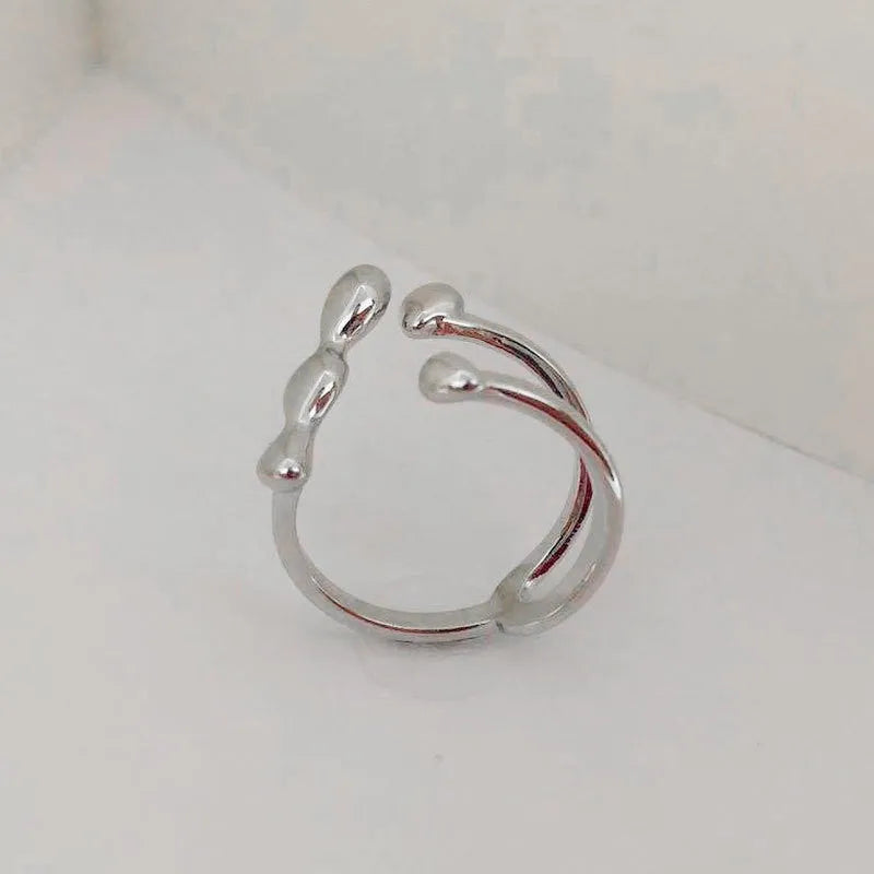 Women's brass opening ring with gold finish and circle sphere design