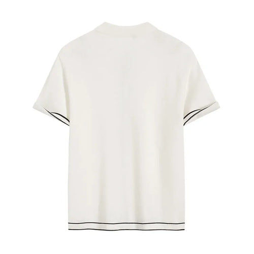 White short-sleeved cardigan with dark contrast lapels laid flat.