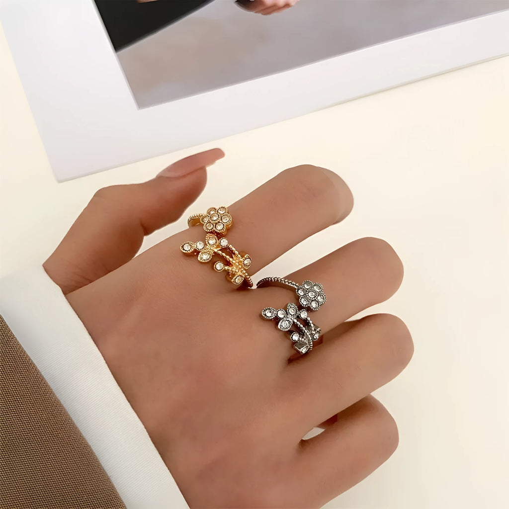Gold and white copper open ring with diamond-finished flower and leaf design for women.