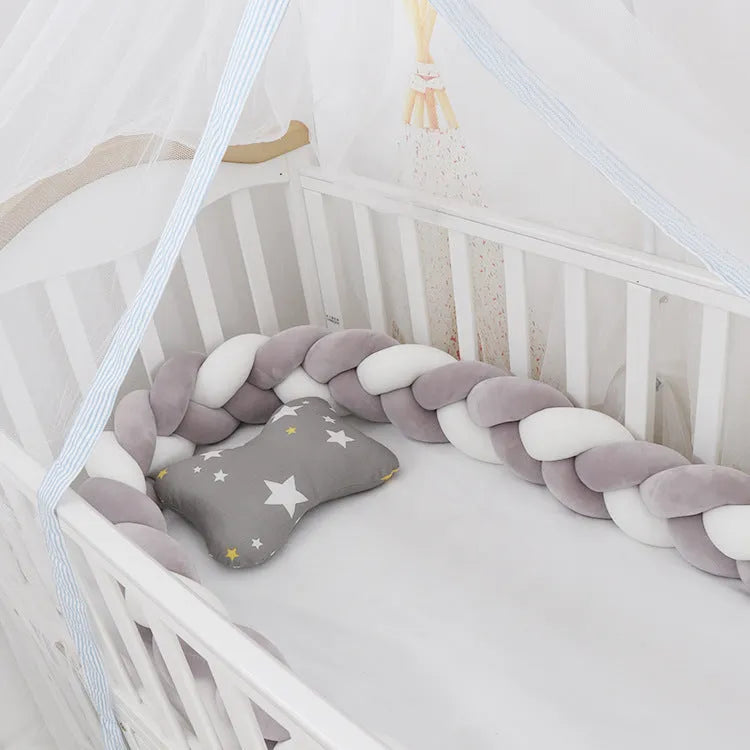 Soft spandex velvet baby crib bumper protector shown in a light grey colour, shaped around white crib bars.