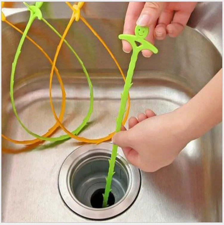 Orange colour kitchen pipe dredging hook made from soft PP, 51 cm long, with a smiling face design