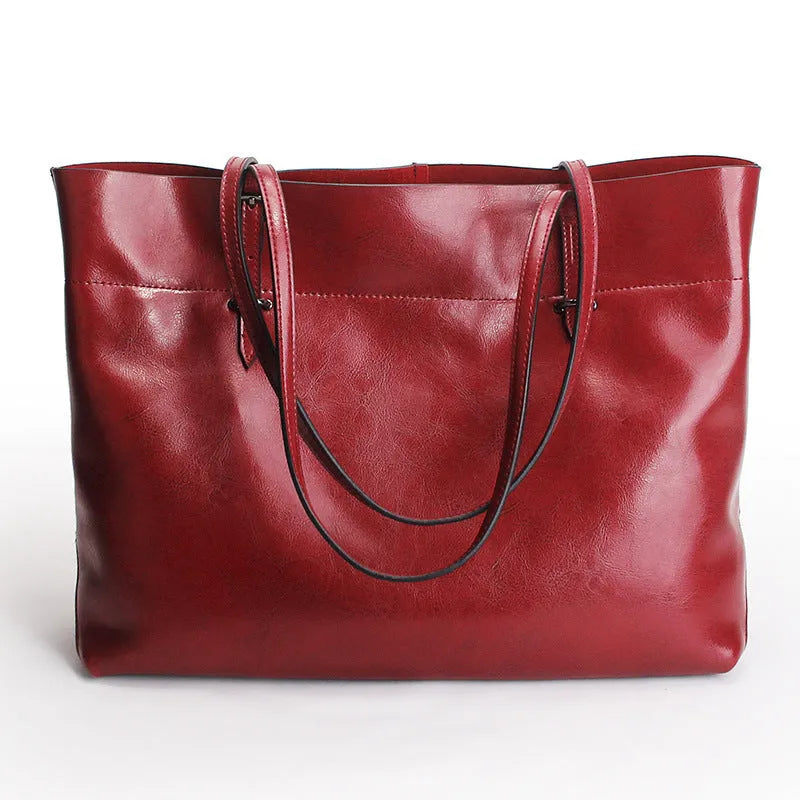 Casual wax cowhide leather ladies crossbody handbag shown in a choice of colours including black, brown, and rose red.
