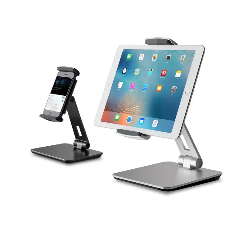 Folding aluminium phone and tablet stand on a desk, shown in silver colour with 360-degree rotation.