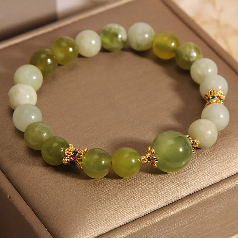 Women's bracelet made of green Xiuyan jade in a light luxury sweet Mori style design.
