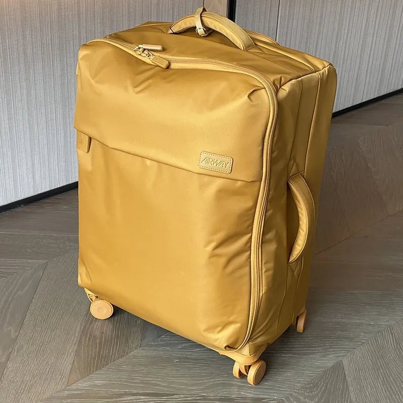Ultra-light waterproof Oxford cloth suitcase with universal wheels in a bluestone green colour.