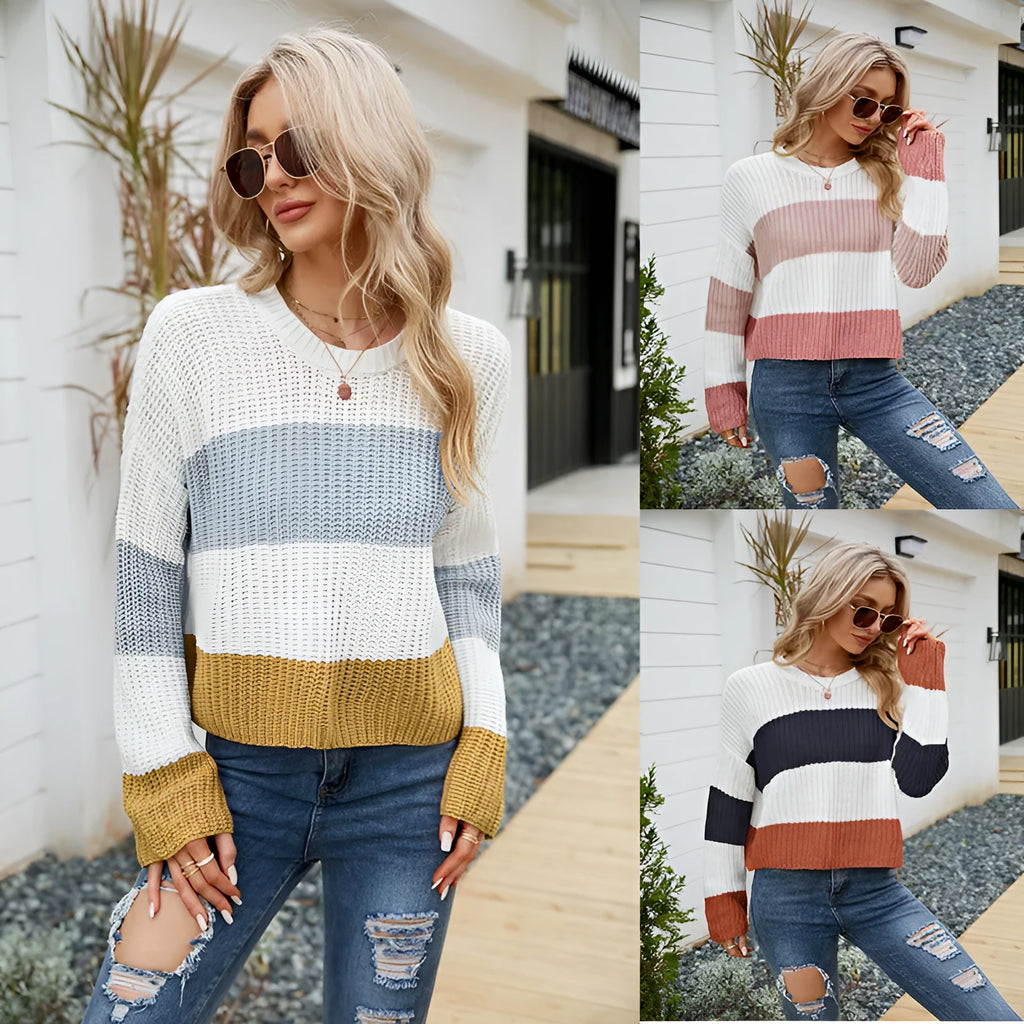 Women's short striped loose-fitting acrylic pullover sweater on a hanger.