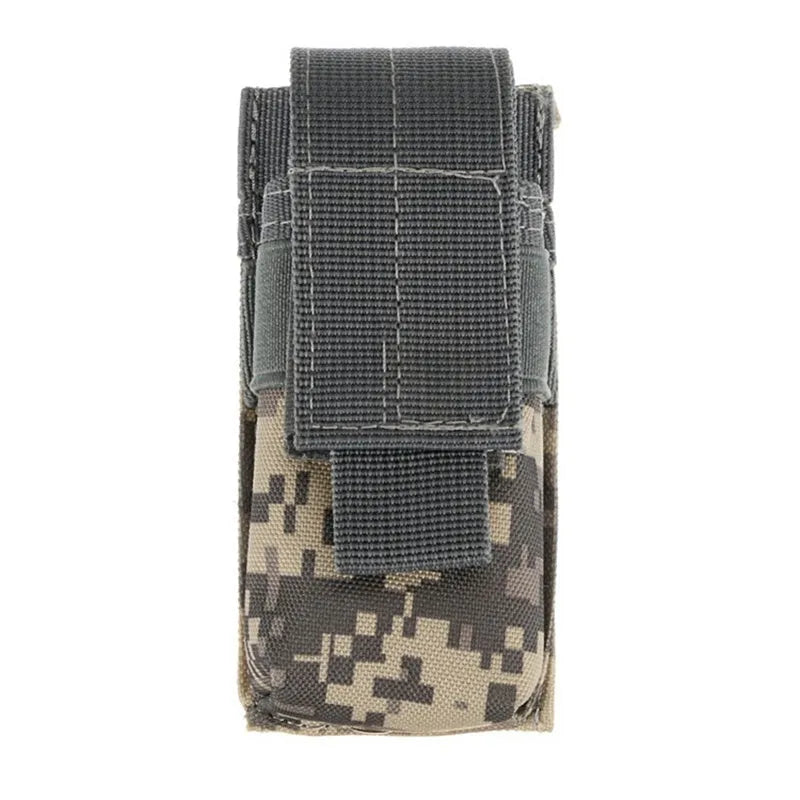 Black tactical Molle waist bag with elastic cord closure, shown next to a pistol cartridge for scale.