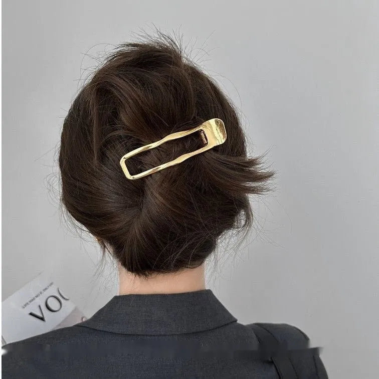 Gold and silver zinc alloy hair barrettes in square, arc, and triangle shapes.