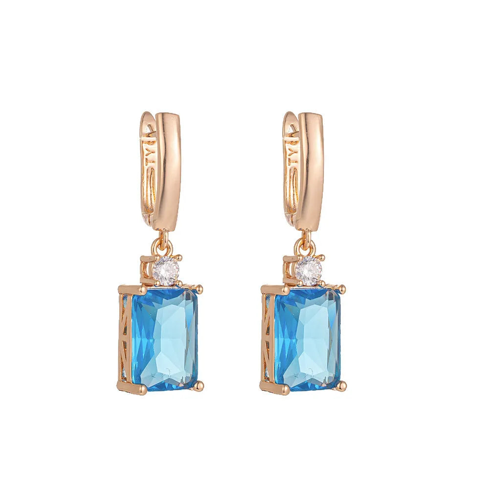 Square geometric copper earrings with gold electroplated finish showing quadrilateral shape