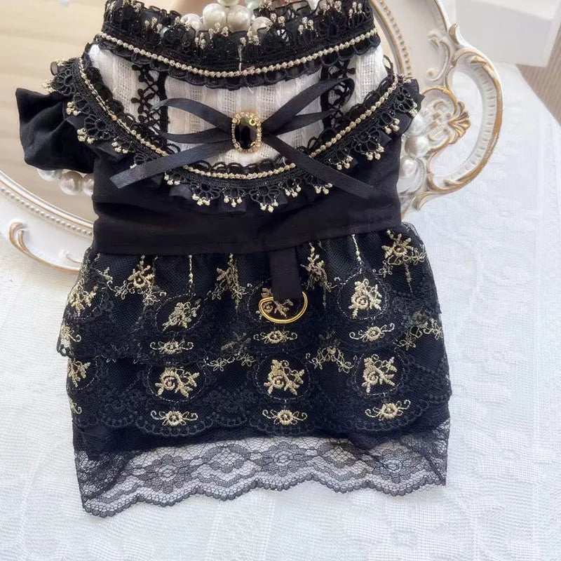 Gold Gothic princess style dress for a small dog or cat on a mannequin.