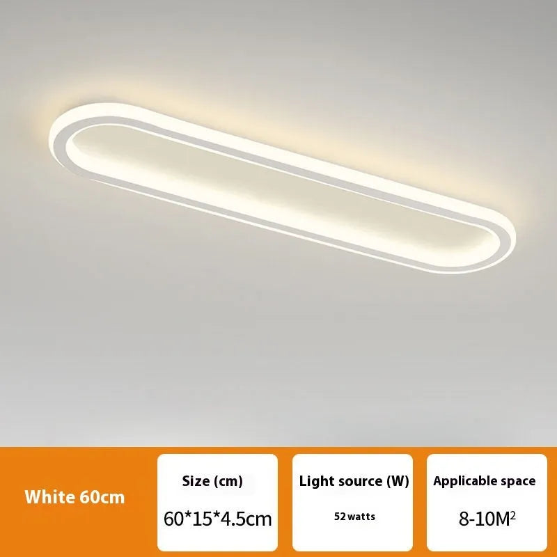 Minimalist black strip ceiling lamp with aluminium body and PVC shade mounted on a white ceiling.