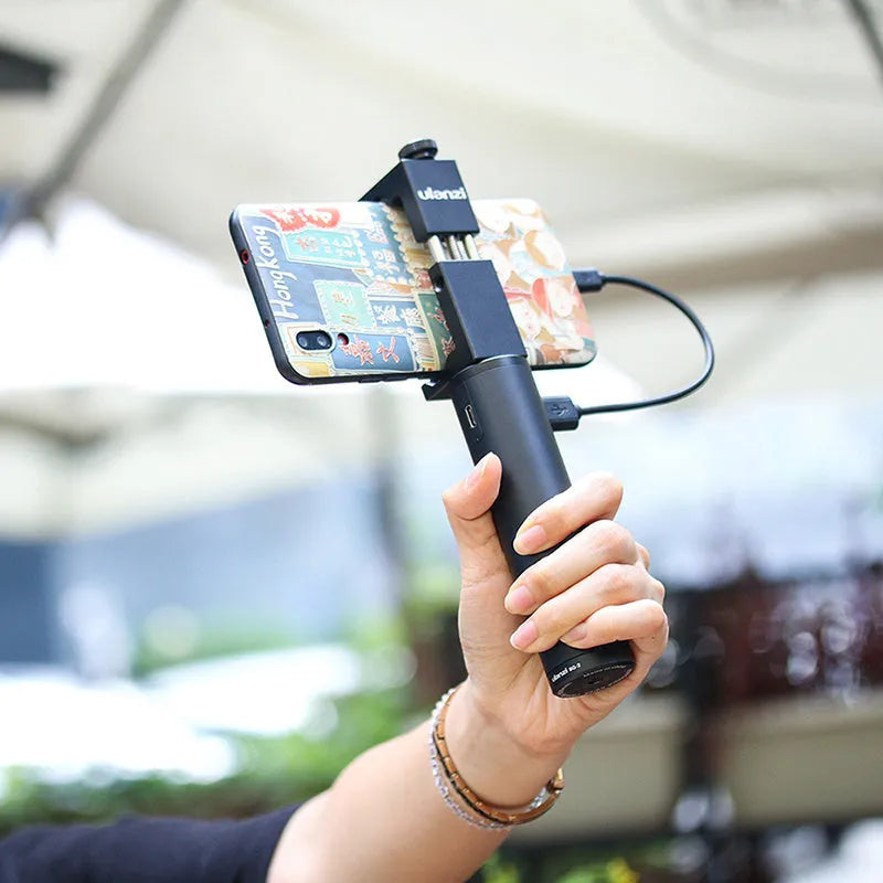 Black aluminium alloy portable power bank with an integrated carry handle, showing front and side profile.