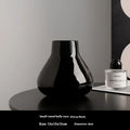 Modern black ceramic vase set with artificial white orchid flowers for home decoration