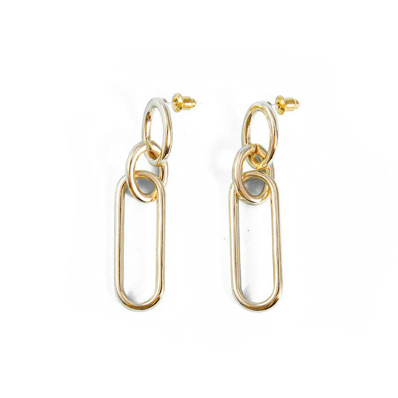 Geometric sterling silver tone hoop earrings for women with a ring and line design.
