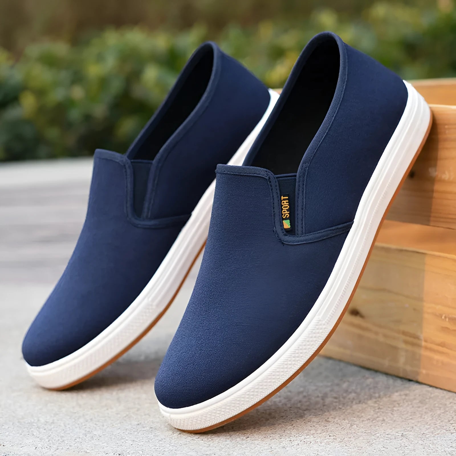 Men's black canvas slip-on shoes with round toe and low-top design