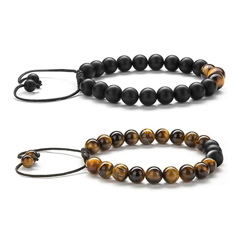 Pair of matte black agate bead bracelets with geometric design for couples.