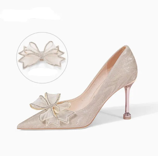 Women's champagne gold stiletto high heels covered in crystal sequins with a pointed toe.