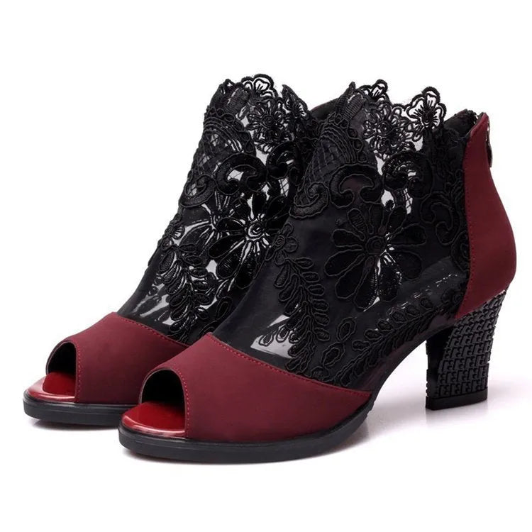Women's black lace gladiator sandals with square heel and zip closure showing floral patterns
