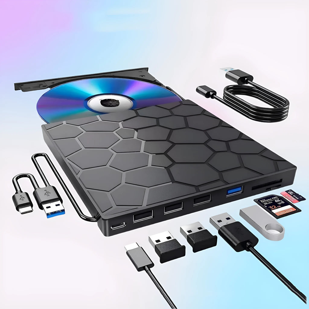 Black external USB CD/DVD writer and reader drive on a desk next to a laptop.