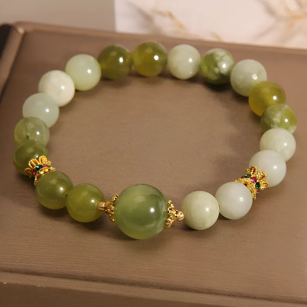 Women's bracelet made of green Xiuyan jade in a light luxury sweet Mori style design.