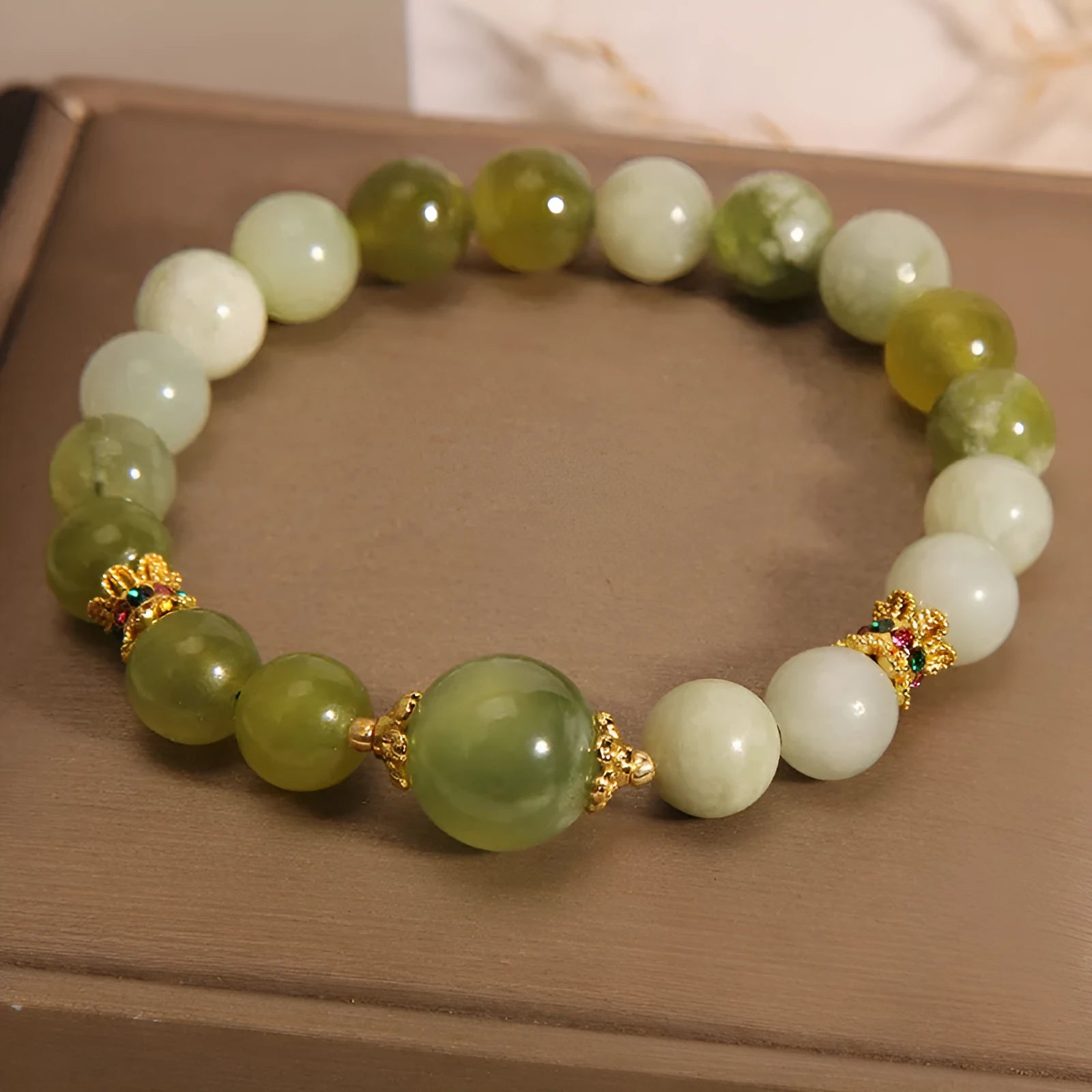 Women's bracelet made of green Xiuyan jade in a light luxury sweet Mori style design.