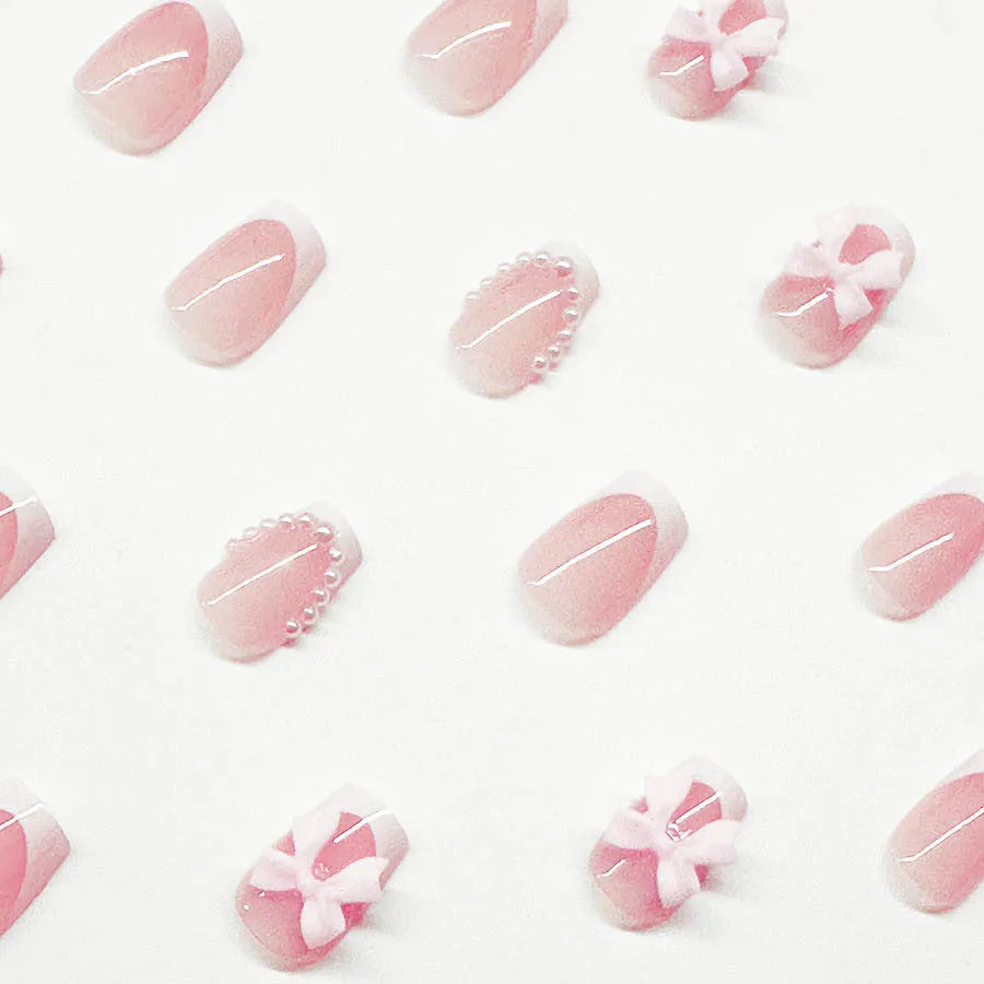 French manicure nail art set showing short white design with tulip, bow, starry sky, leopard print, and XINGX patterns
