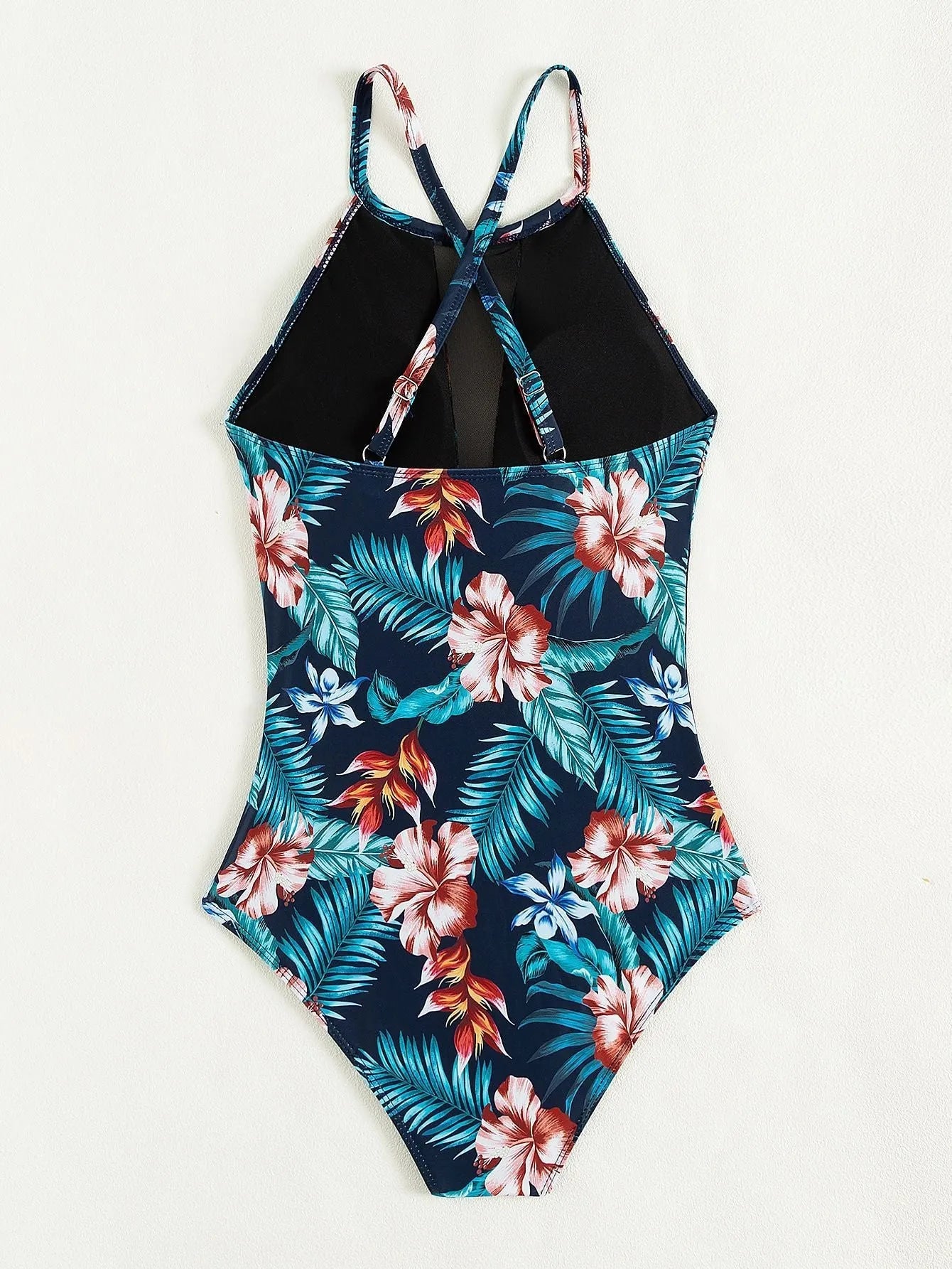 Women's deep V-neck one-piece swimsuit in a solid or gradient colour on a mannequin.