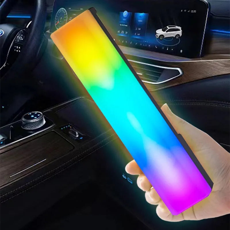 Black and white 3D RGB tabletop ambiance lamp with voice-activated rhythm lights for gaming and decor.