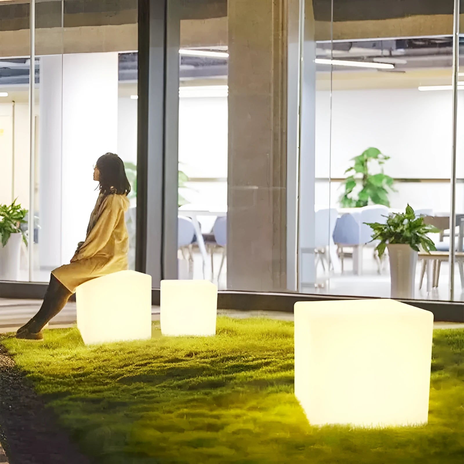 Square LED cube light stool in modern design showing waterproof PE construction with solar panel or charging port visible