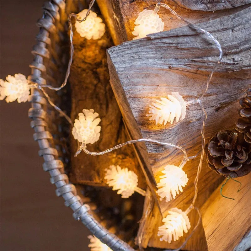 Battery-powered warm white LED pine cone light string for decorative indoor and outdoor use