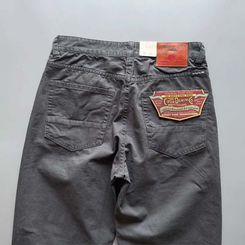 Men's straight-leg cotton trousers in grey, army green, or khaki showing retro casual style.