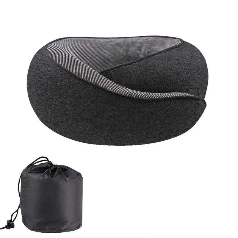 U-shaped grey memory foam travel neck pillow with a black storage bag on a plain background.
