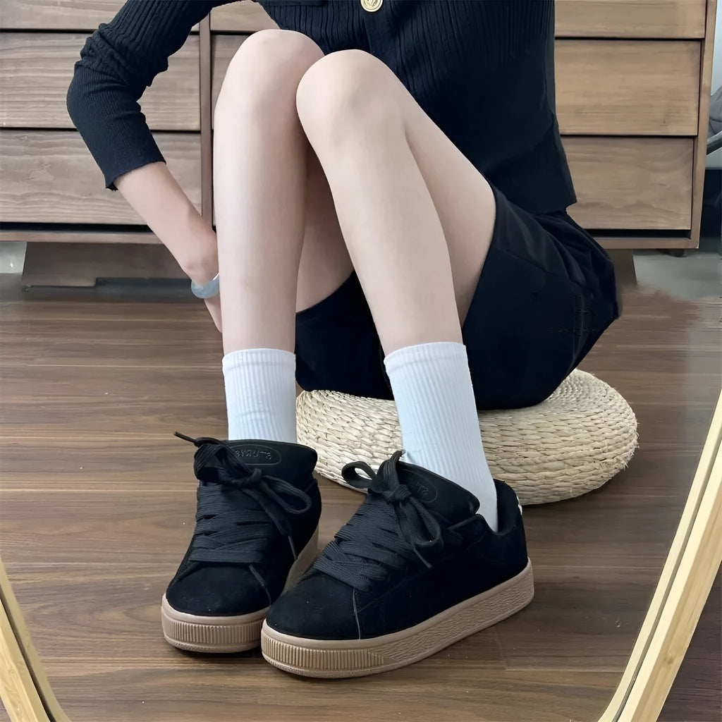 Black retro low-top sneakers with round toe and English muffin heel on waterproof platform
