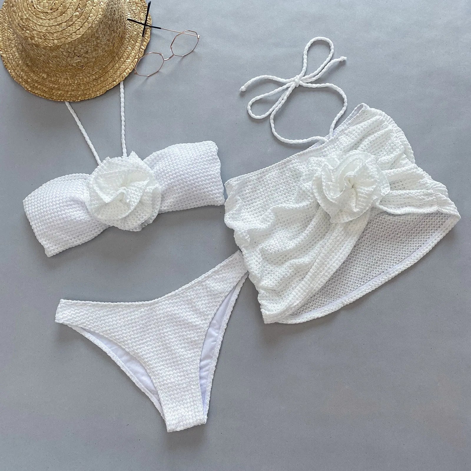 Women's 3D flower split three-piece bikini set in purple or white.