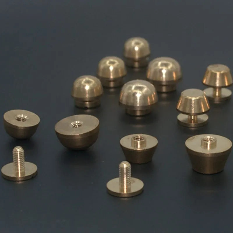 Brass decorative buckles showing round and bucket foot nail designs in 10x6mm and 12x7mm sizes