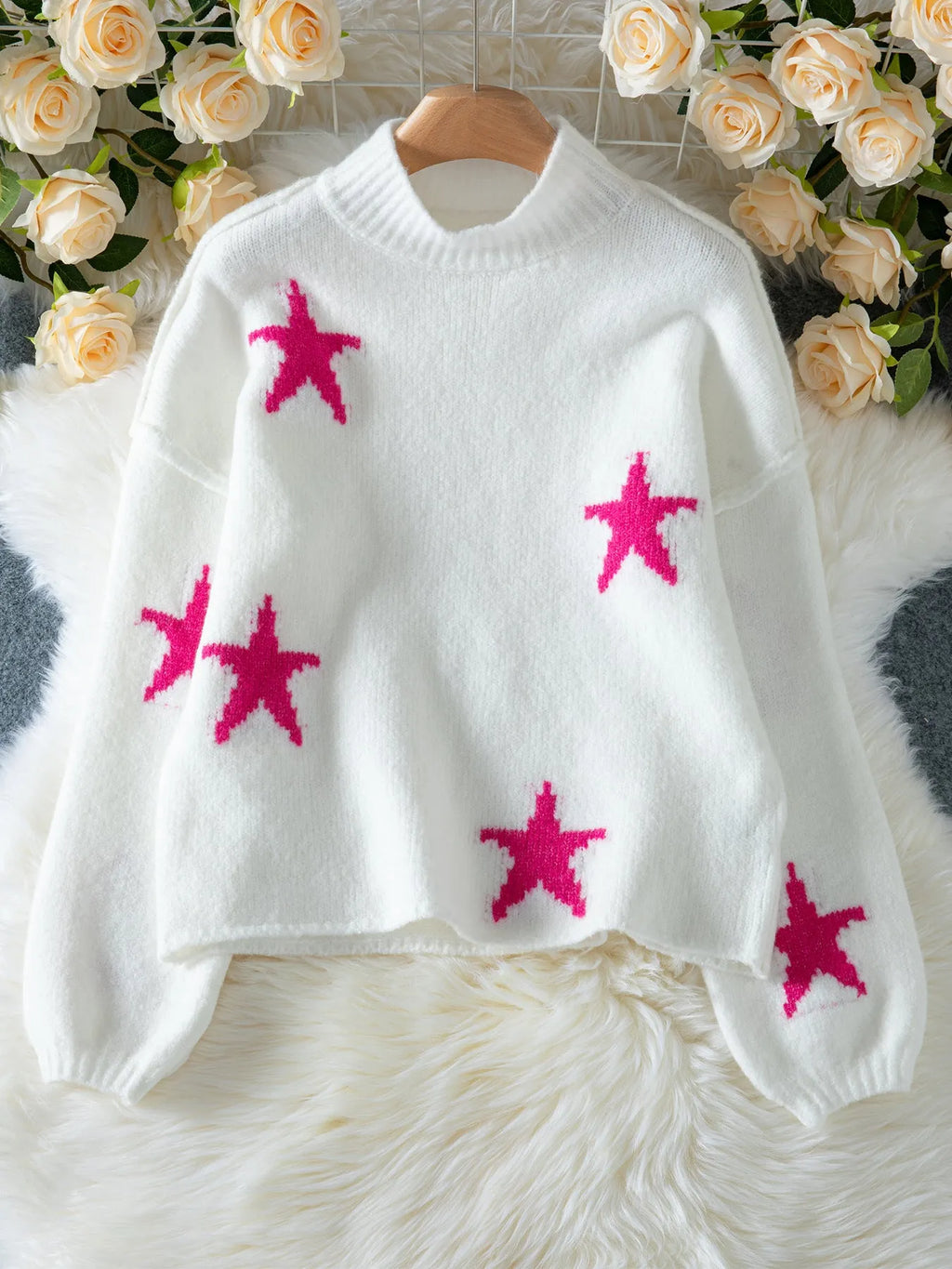 White women's turtleneck pullover with five-pointed star pattern and loose fit design