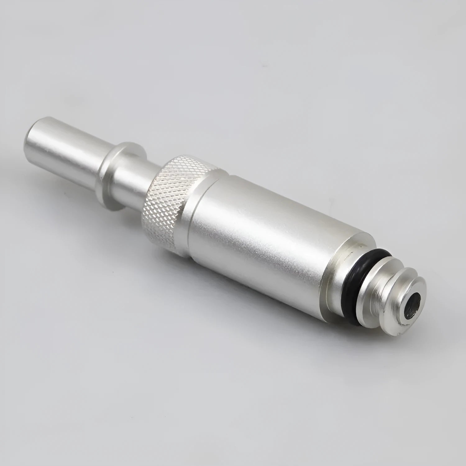 Silver metal VAS6262-9 transmission refueling joint adapter tool on a workshop bench