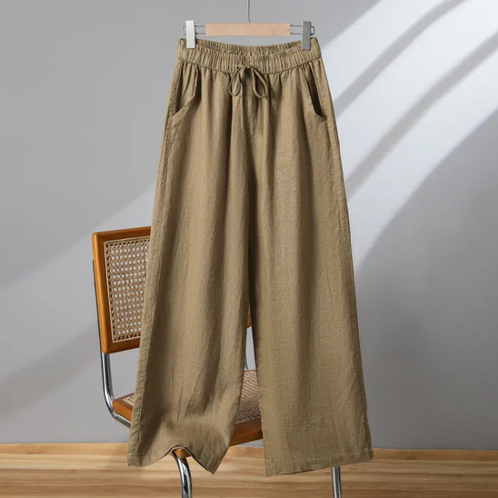 Women's straight-leg casual trousers in apricot colour with elastic waist and lace-up drawstring detail