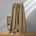 Women's straight-leg casual trousers in apricot colour with elastic waist and lace-up drawstring detail