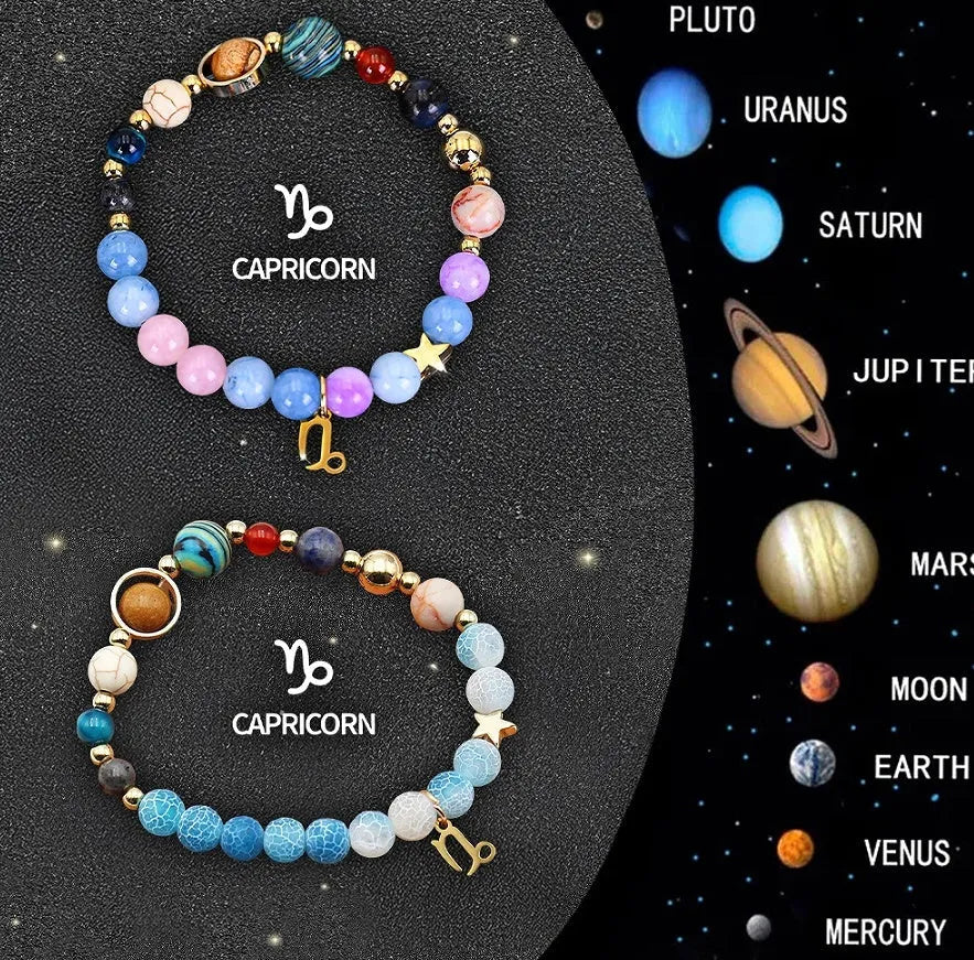 Set of two natural stone beaded bracelets with zodiac charms on a textured background.