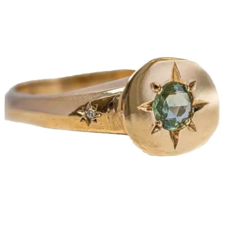 Golden star-shaped ring with oval zircon stone and adjustable opening