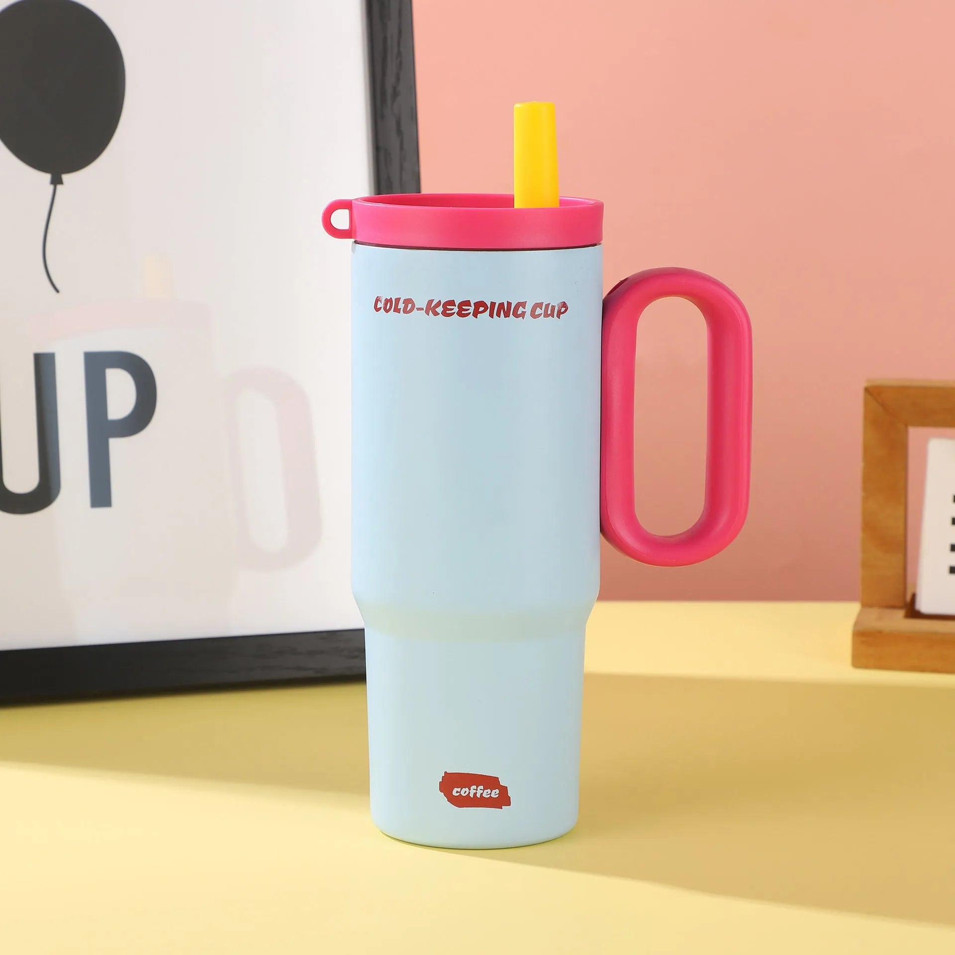 Insulated straw cup with handle in multiple colours showing 700ml capacity