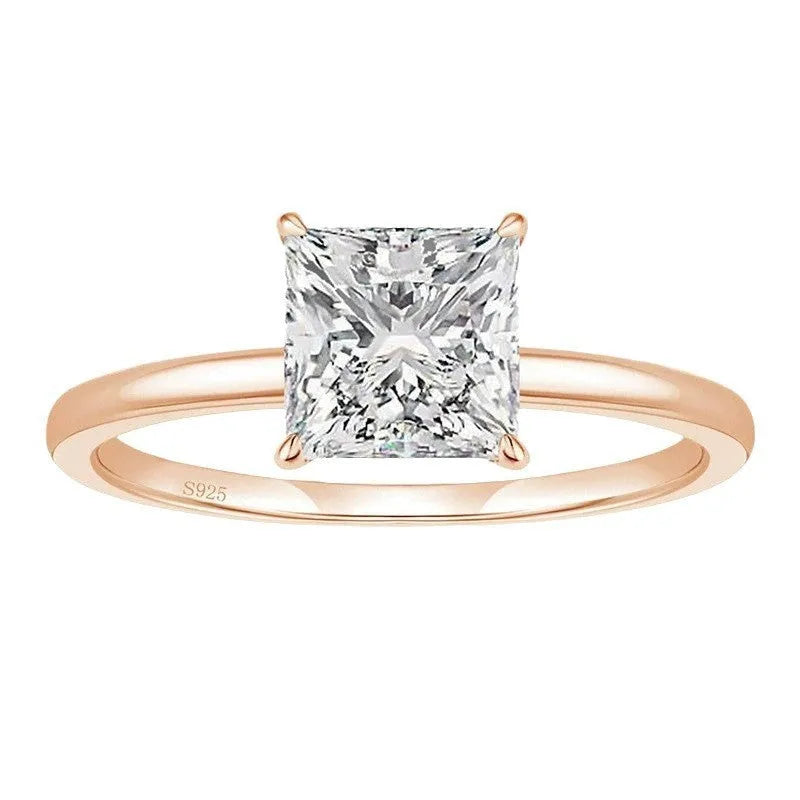 Simple geometric 925 silver ring in silver, gold, and rose gold colours on a plain background.